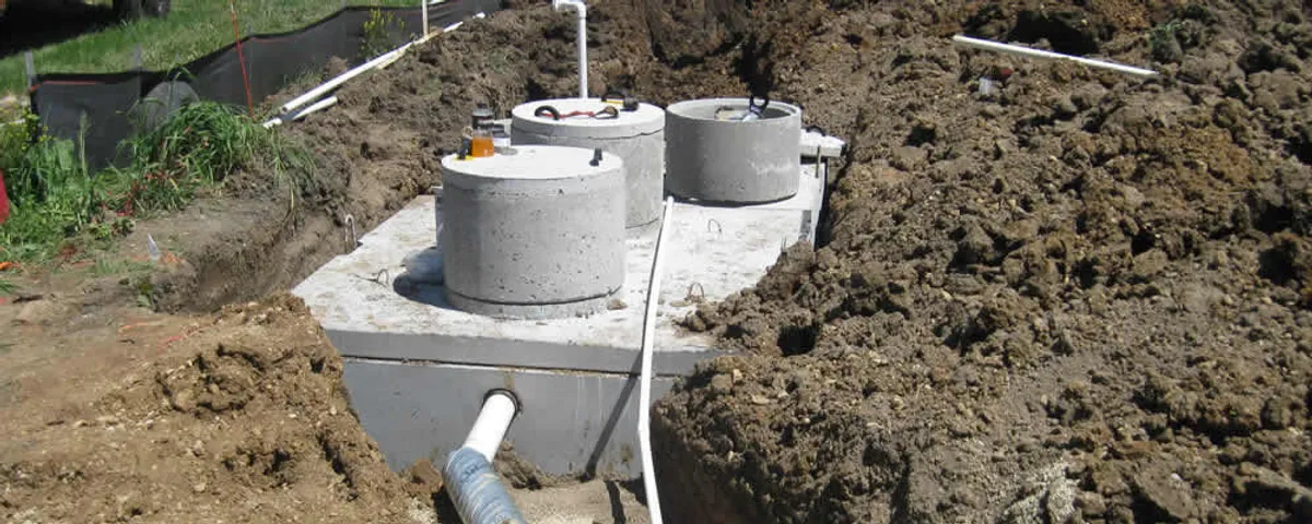 Septic system repair and installation site with tank access ports in Tacoma, WA